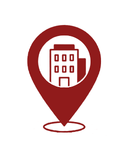 Red map pin containing a white building icon, signaling a location for a business or address area